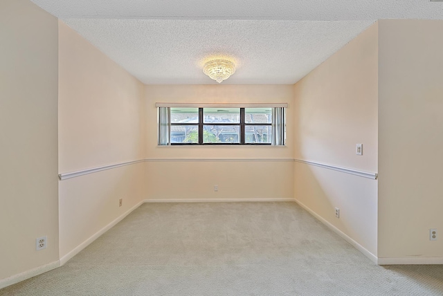 1127 E Seminole Ave Unit 14D, Jupiter, FL 33477 - unfurnished room featuring carpet floors, a textured ceiling, and baseboards