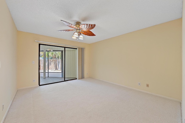 1127 E Seminole Ave Unit 14D, Jupiter, FL 33477 - carpeted empty room featuring ceiling fan, baseboards, and a textured ceiling