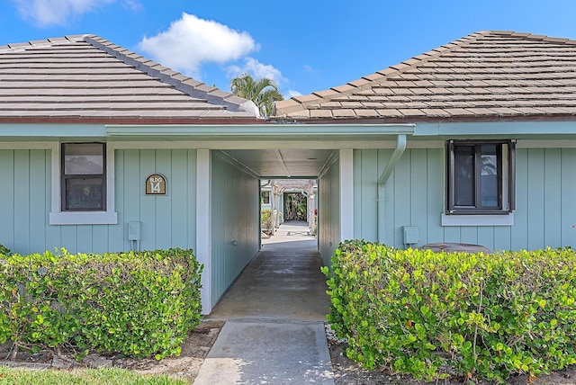 1127 E Seminole Ave Unit 14D, Jupiter, FL 33477 - doorway to property with a tiled roof
