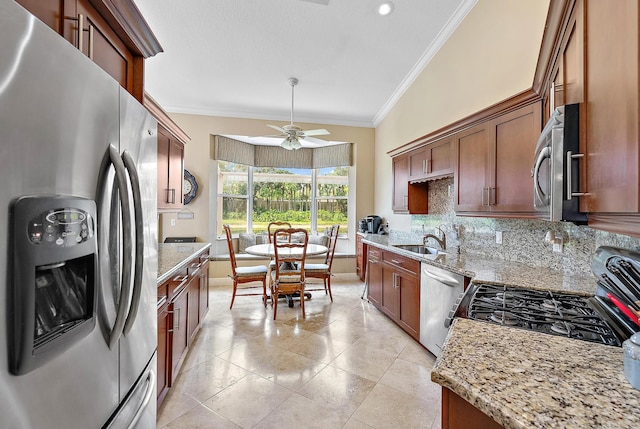 kitchen featuring stainless steel appliances, ornamental molding, tasteful backsplash, a sink, and light tile patterned floors