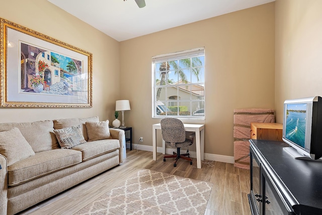 office area featuring light wood-style flooring and baseboards