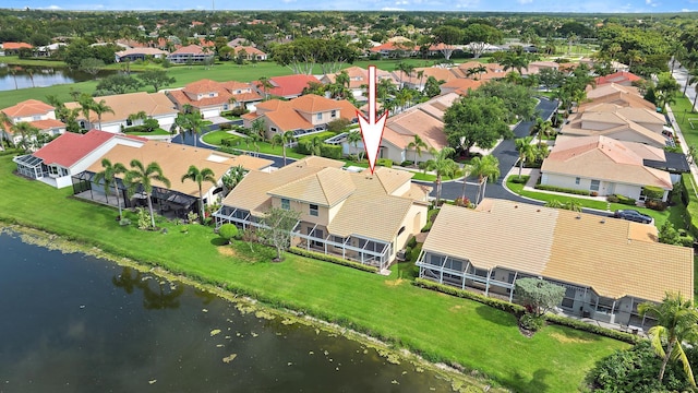 aerial view of residential area with a nearby body of water