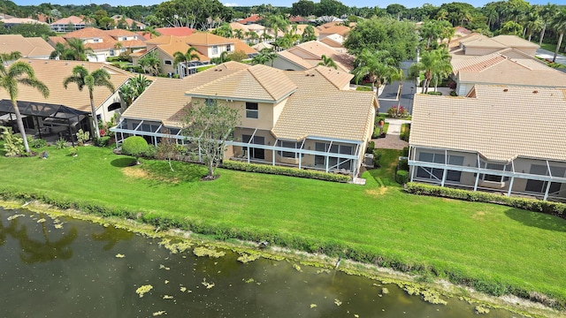 aerial perspective of suburban area featuring a nearby body of water
