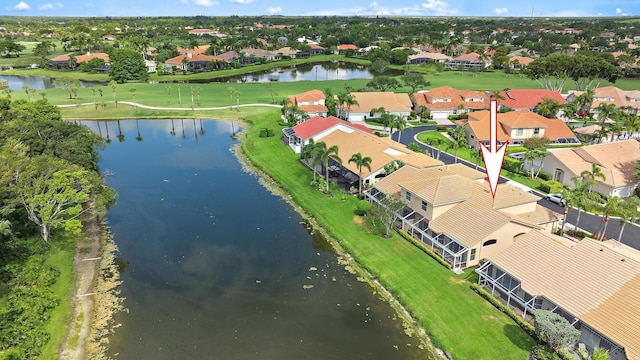 aerial view of residential area featuring a large body of water