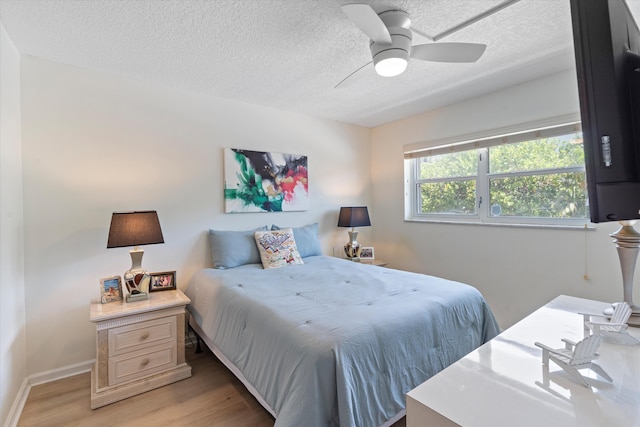 2016 S Federal Hwy Unit 206, Boynton Beach, FL 33435 - bedroom with light wood finished floors, a textured ceiling, a ceiling fan, and baseboards