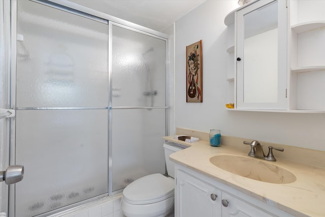 2016 S Federal Hwy Unit 206, Boynton Beach, FL 33435 - full bathroom with a stall shower, toilet, and vanity