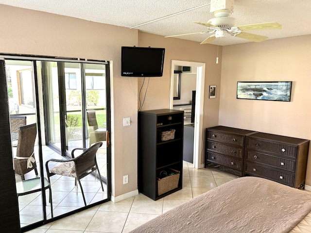 11231 Green Lake Dr Unit 104, Boynton Beach, FL 33437 - bedroom with access to exterior, light tile patterned floors, a textured ceiling, and a ceiling fan