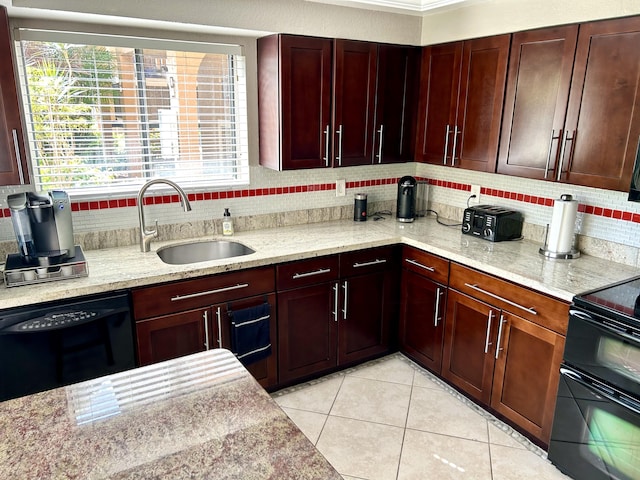 11231 Green Lake Dr Unit 104, Boynton Beach, FL 33437 - kitchen with a sink, black appliances, tasteful backsplash, and light tile patterned flooring