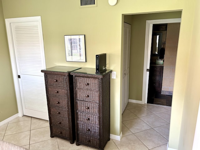 11231 Green Lake Dr Unit 104, Boynton Beach, FL 33437 - bedroom with light tile patterned floors and baseboards