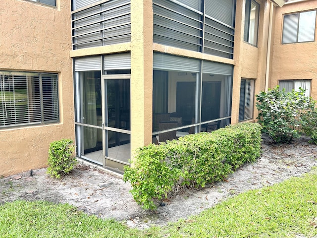 11231 Green Lake Dr Unit 104, Boynton Beach, FL 33437 - view of side of property featuring stucco siding