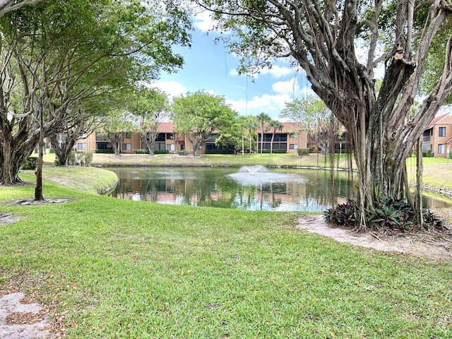 11231 Green Lake Dr Unit 104, Boynton Beach, FL 33437 - view of green lawn featuring a water view and a residential view