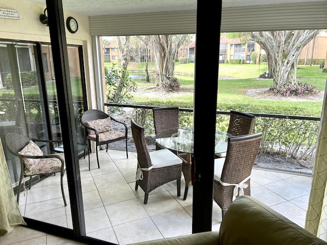11231 Green Lake Dr Unit 104, Boynton Beach, FL 33437 - sunroom with outdoor dining space