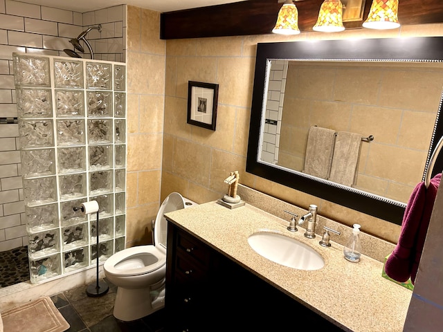 11231 Green Lake Dr Unit 104, Boynton Beach, FL 33437 - bathroom featuring walk in shower, tile walls, vanity, toilet, and tile patterned flooring