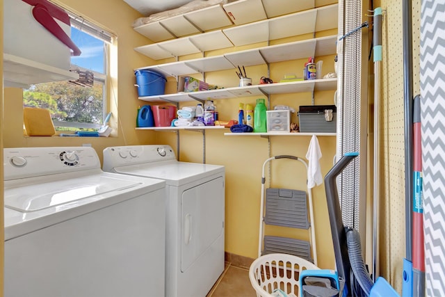 laundry room with separate washer and dryer and tile patterned floors