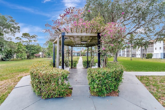 view of home's community with a lawn