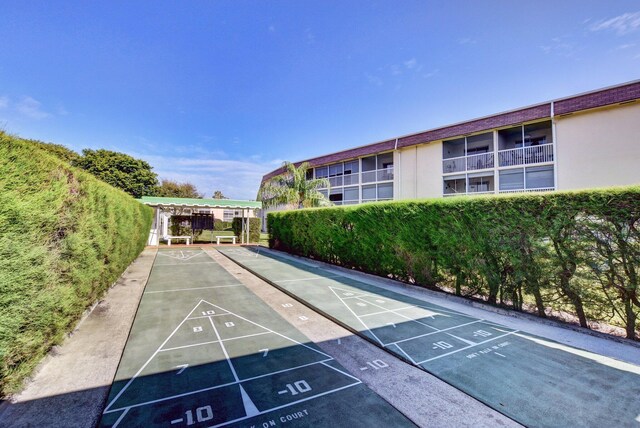 view of property's community with shuffleboard