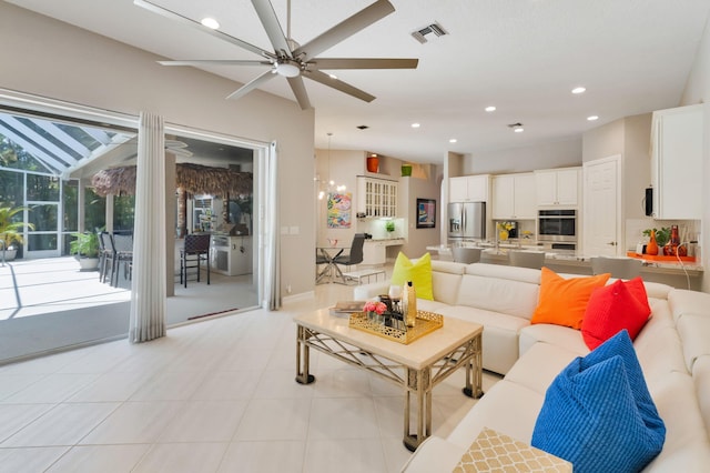 living room featuring ceiling fan and recessed lighting