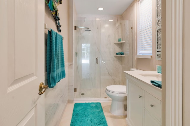 full bath featuring toilet, a marble finish shower, vanity, tile patterned flooring, and plenty of natural light