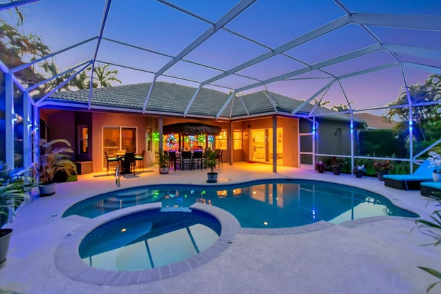 view of swimming pool featuring a patio area and a pool with connected hot tub
