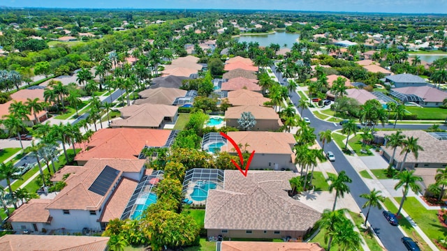 aerial view of residential area with a large body of water