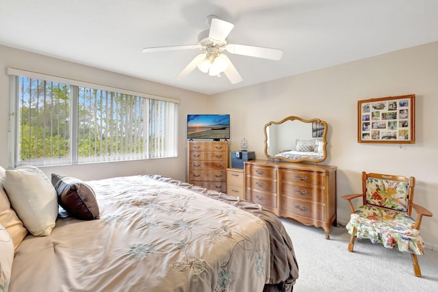 carpeted bedroom with a ceiling fan