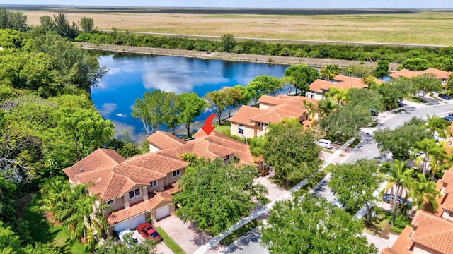 aerial perspective of suburban area featuring a nearby body of water