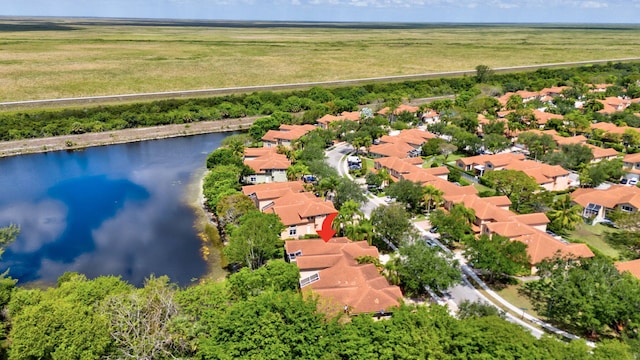 aerial view of residential area featuring a nearby body of water