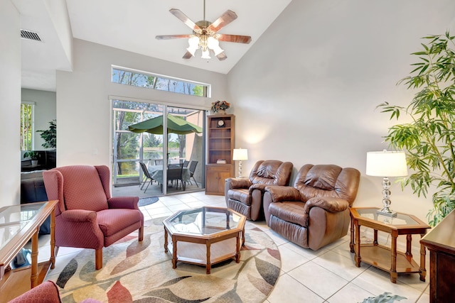 living room featuring high vaulted ceiling, light tile patterned flooring, and ceiling fan