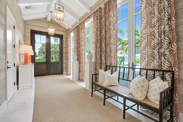 doorway to outside with a chandelier