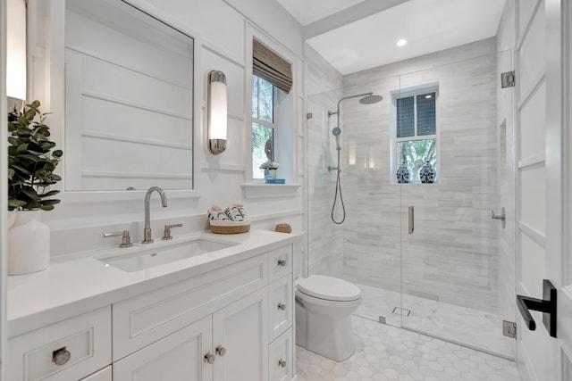full bathroom featuring a shower stall, toilet, vanity, tile patterned flooring, and recessed lighting
