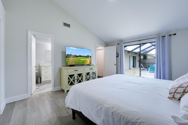 bedroom with access to outside, vaulted ceiling, wood finished floors, baseboards, and connected bathroom