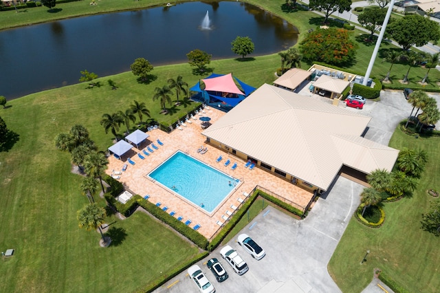 aerial view of a nearby body of water and a pool