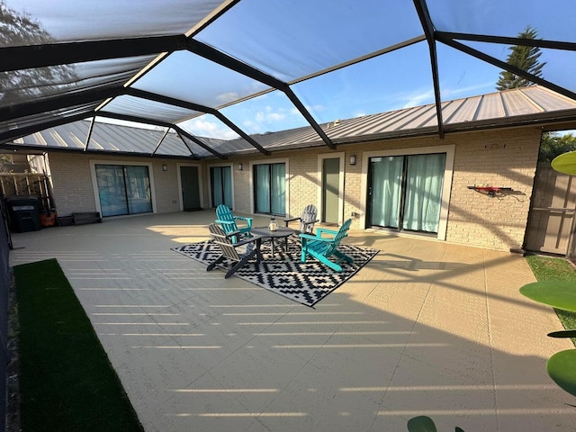 view of patio / terrace with a lanai