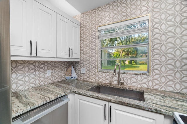 1150 NW 13th St Unit 172C, Boca Raton, FL 33486 - kitchen with stainless steel dishwasher, a sink, decorative backsplash, and white cabinets