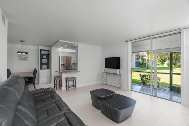 1150 NW 13th St Unit 172C, Boca Raton, FL 33486 - living room featuring light tile patterned flooring and baseboards