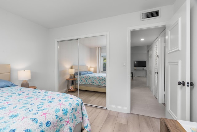 1150 NW 13th St Unit 172C, Boca Raton, FL 33486 - bedroom with a closet, light wood-style floors, baseboards, and recessed lighting