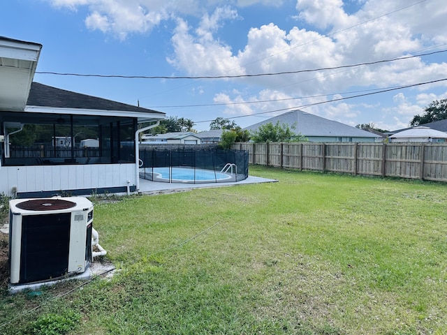 574 NW Marion Ave, Port Saint Lucie, FL 34983 - view of yard with central AC unit and a sunroom