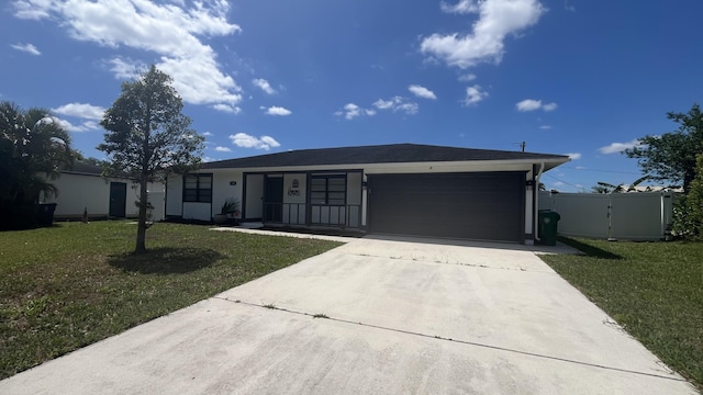 574 NW Marion Ave, Port Saint Lucie, FL 34983 - ranch-style house with driveway, a garage, and a gate