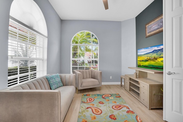 7816 Red River Rd, West Palm Beach, FL 33411 - living area featuring light wood-style flooring, a ceiling fan, and baseboards