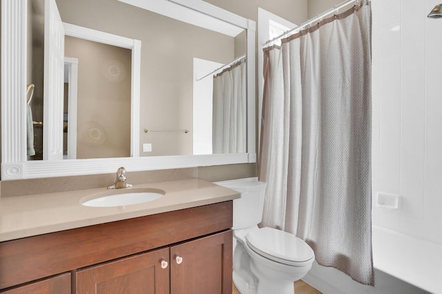 7816 Red River Rd, West Palm Beach, FL 33411 - bathroom featuring toilet, vanity, and shower / tub combo