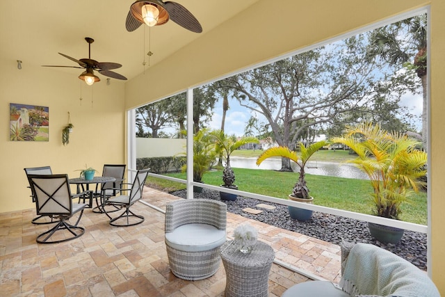7816 Red River Rd, West Palm Beach, FL 33411 - sunroom featuring a water view, ceiling fan, and outdoor dining area