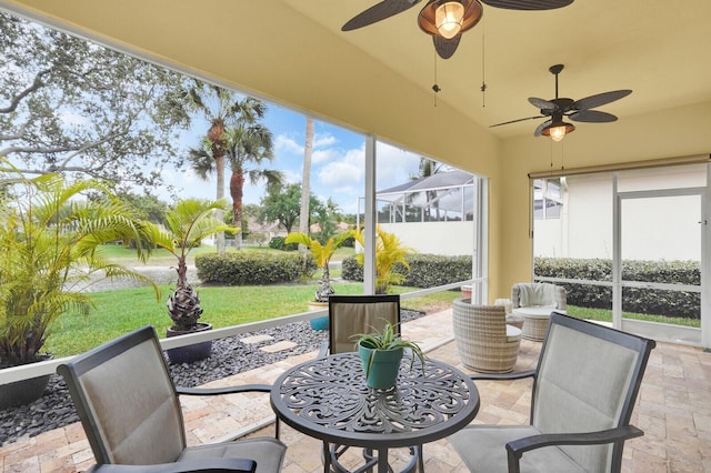 7816 Red River Rd, West Palm Beach, FL 33411 - sunroom featuring a ceiling fan, vaulted ceiling, and outdoor dining space