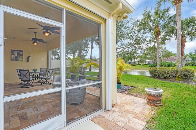 7816 Red River Rd, West Palm Beach, FL 33411 - sunroom with a water view and ceiling fan
