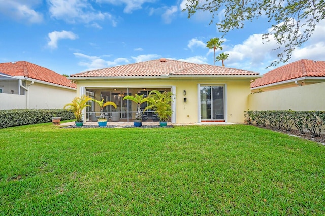 7816 Red River Rd, West Palm Beach, FL 33411 - rear view of property with a tiled roof, a sunroom, and stucco siding