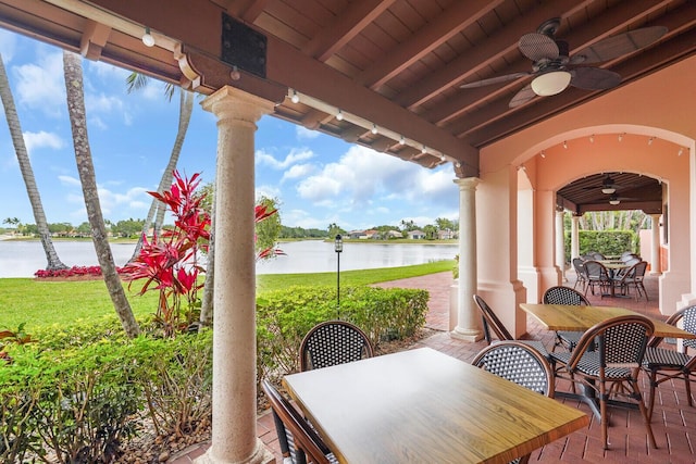 7816 Red River Rd, West Palm Beach, FL 33411 - view of patio / terrace with outdoor dining space, ceiling fan, and a water view