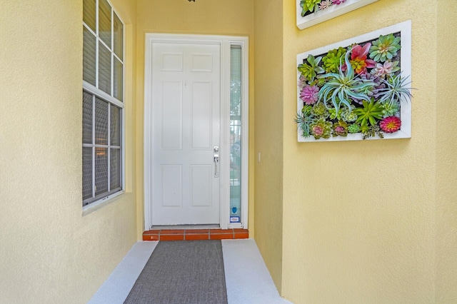 7816 Red River Rd, West Palm Beach, FL 33411 - view of exterior entry featuring stucco siding