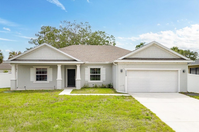 2509 SW Kenilworth St, Port Saint Lucie, FL 34953 - view of front of property with a garage, a front yard, concrete driveway, stucco siding, and roof with shingles