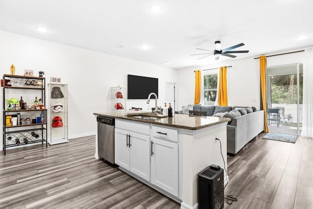 2509 SW Kenilworth St, Port Saint Lucie, FL 34953 - kitchen with stainless steel dishwasher, a sink, ceiling fan, wood finished floors, and recessed lighting