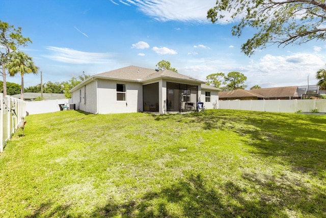 2509 SW Kenilworth St, Port Saint Lucie, FL 34953 - rear view of property featuring a sunroom and stucco siding