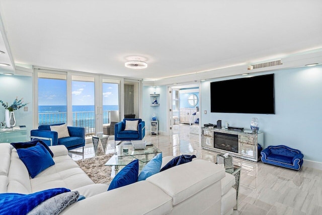 3000 S Ocean Blvd Unit 6010, Boca Raton, FL 33432 - living area with expansive windows, baseboards, and plenty of natural light